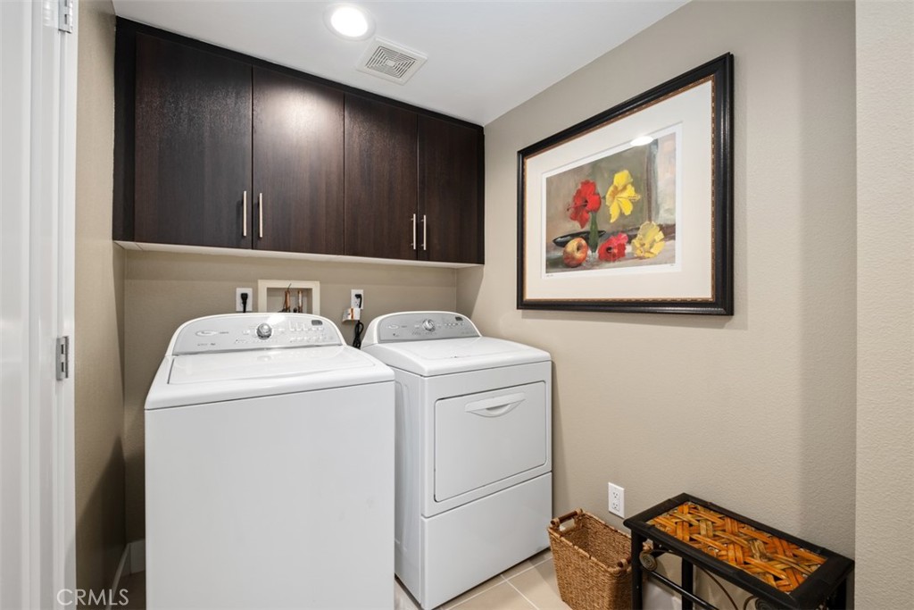 87 Lennox Irvine, CA 92612 - Photo 21 of 59 a view of storage and utility room with washer and dryer