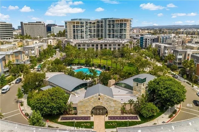 a living room with fireplace furniture and a large window