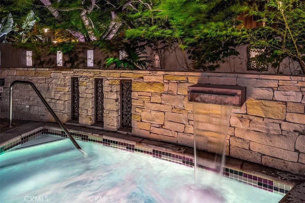 87 Lennox Irvine, CA 92612 - Photo 42 of 59 a wooden bench sitting in front of a building