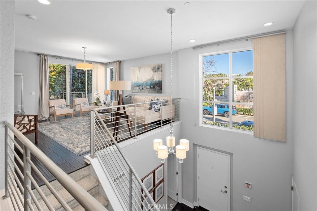 87 Lennox Irvine, CA 92612 - Photo 10 of 59 a view of a kitchen with kitchen island granite countertop a large window cabinets a sink and stainless steel appliances