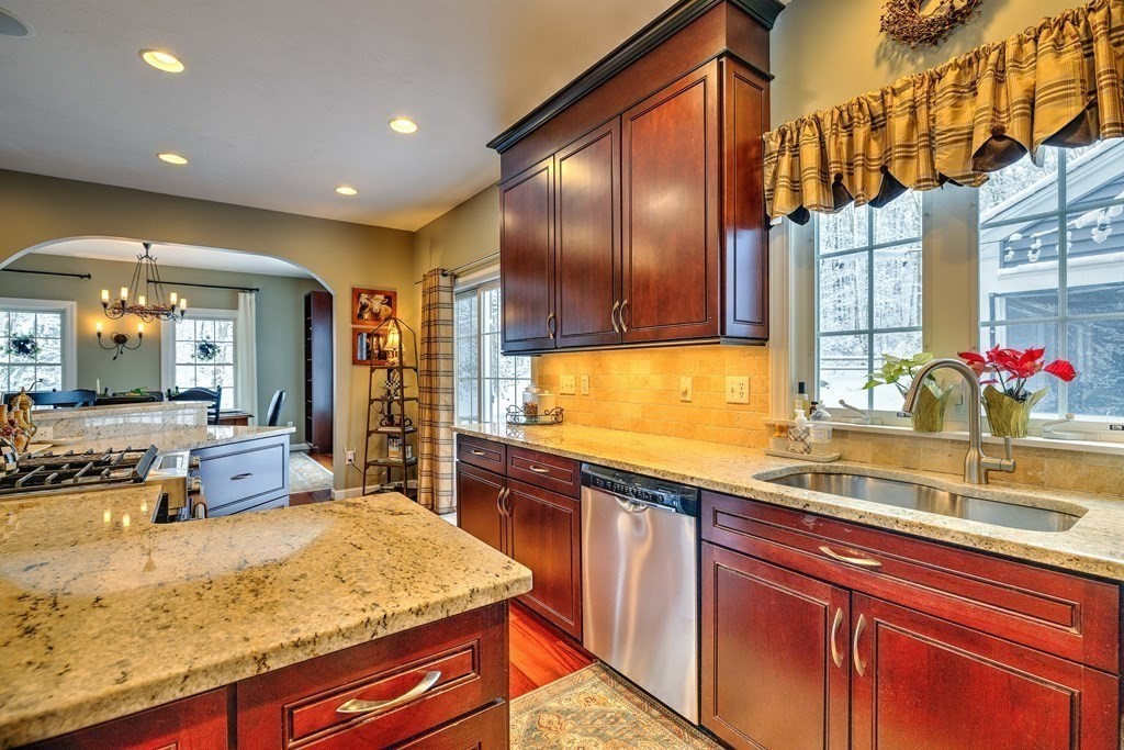 59 Lake Road Brookfield, MA 01506 - Photo 11 of 42 a kitchen with stainless steel appliances granite countertop sink stove and cabinets