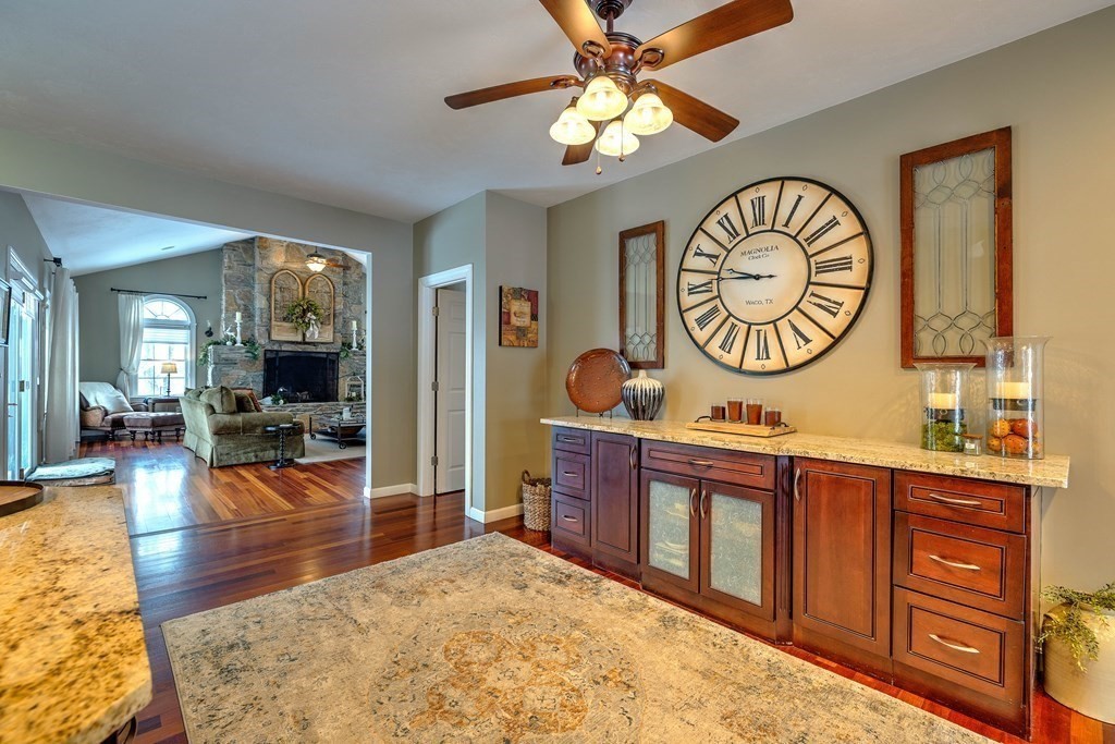 59 Lake Road Brookfield, MA 01506 - Photo 13 of 42 a view of a kitchen area with furniture and wooden floor