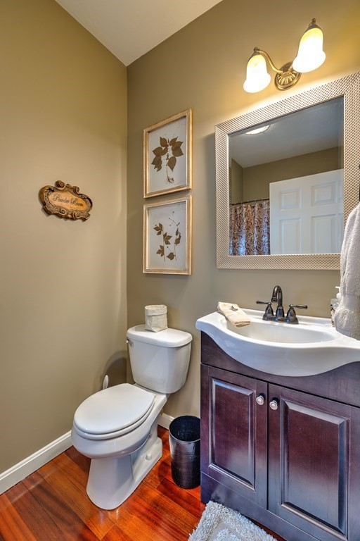59 Lake Road Brookfield, MA 01506 - Photo 17 of 42 a bathroom with a toilet a sink and mirror