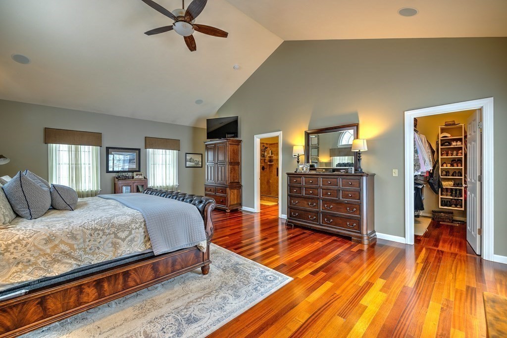 59 Lake Road Brookfield, MA 01506 - Photo 19 of 42 a bedroom with a bed and wooden floor