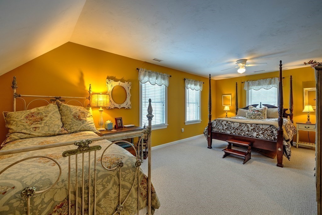 59 Lake Road Brookfield, MA 01506 - Photo 24 of 42 a bedroom with a bed and a mirror