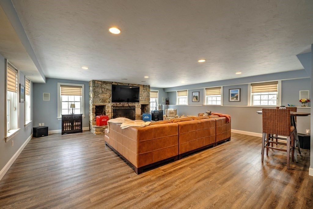 59 Lake Road Brookfield, MA 01506 - Photo 28 of 42 a living room with furniture fireplace and flat screen tv