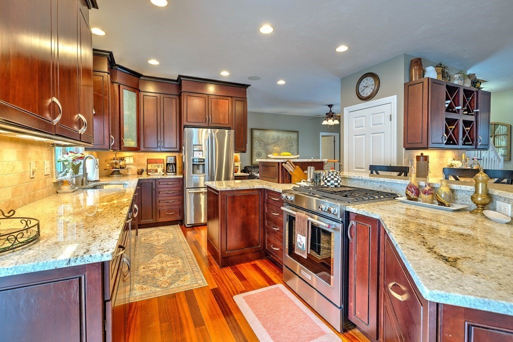 59 Lake Road Brookfield, MA 01506 - Photo 7 of 42 a kitchen with stainless steel appliances granite countertop a stove and a large window