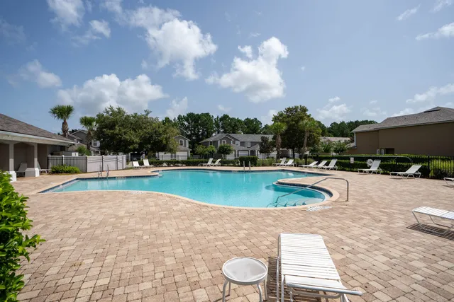 a view of a swimming pool with a patio