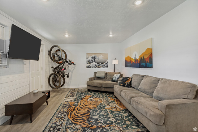730 Geranium Street Sandy, UT 84094 - Photo 8 of 35 Recessed ceiling lighting, wood-finish flooring, white painted walls, and a white paneled door
