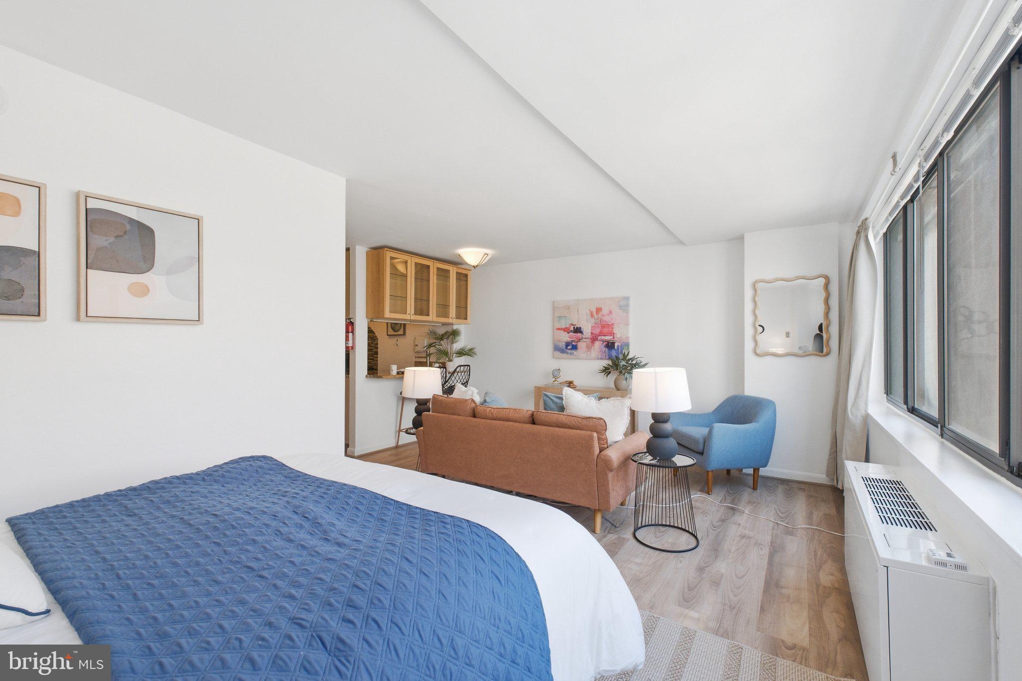 522 21st Street Northwest, Unit 407 Washington, DC 20006 - Photo 12 of 17 a bedroom with furniture and a window