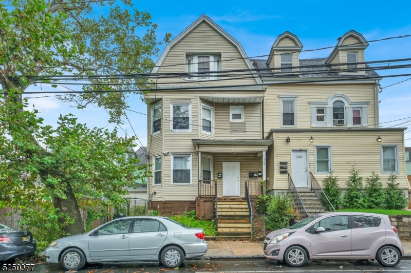 348 13th Avenue, Unit 3 Newark, NJ 07103 - Photo 3 of 14 a front view of a house with parking space