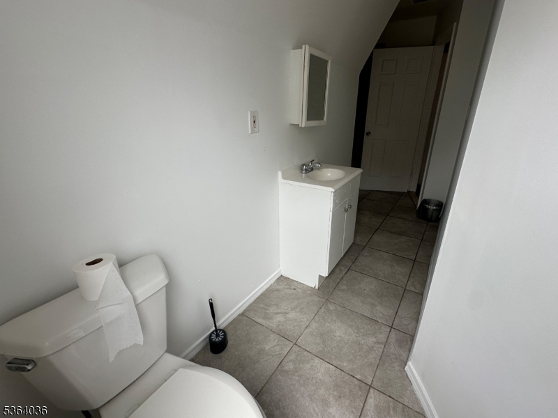 348 13th Avenue, Unit 3 Newark, NJ 07103 - Photo 8 of 14 a bathroom with a toilet and sink