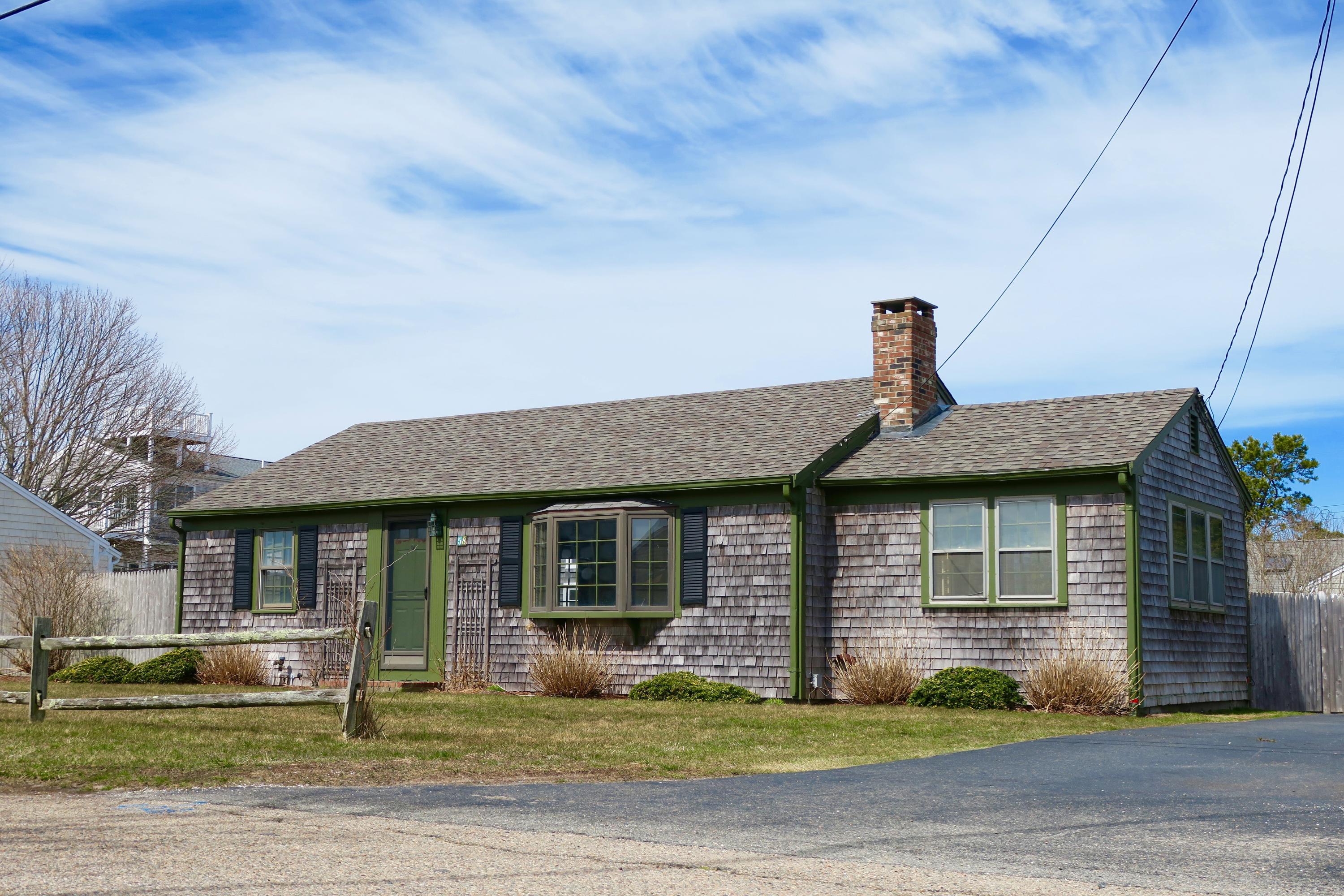 58 Surfside Road West Dennis, MA 02670 - Photo 1 of 31 a front view of a house with garden