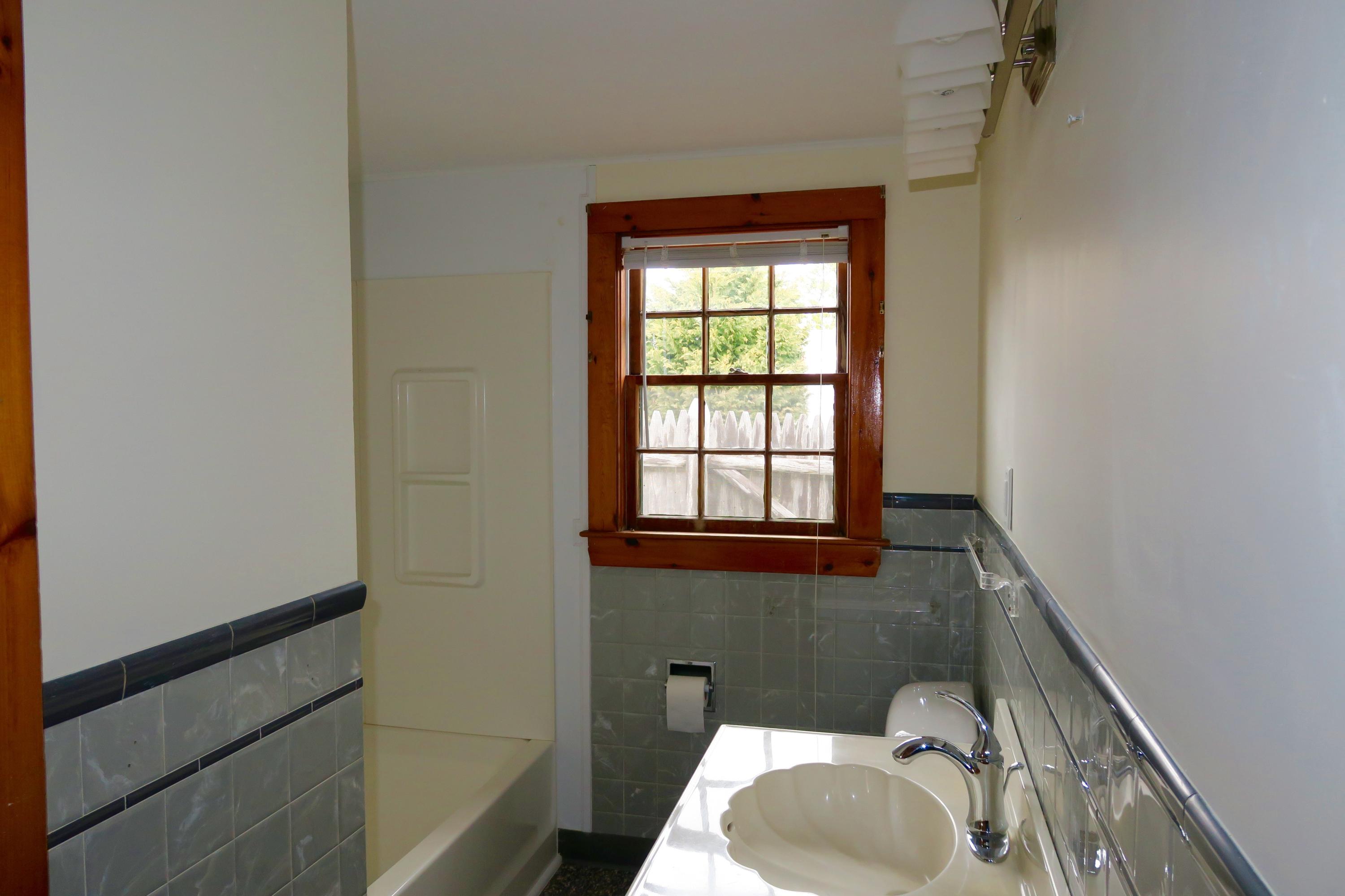 58 Surfside Road West Dennis, MA 02670 - Photo 15 of 31 a bathroom with a sink toilet and window