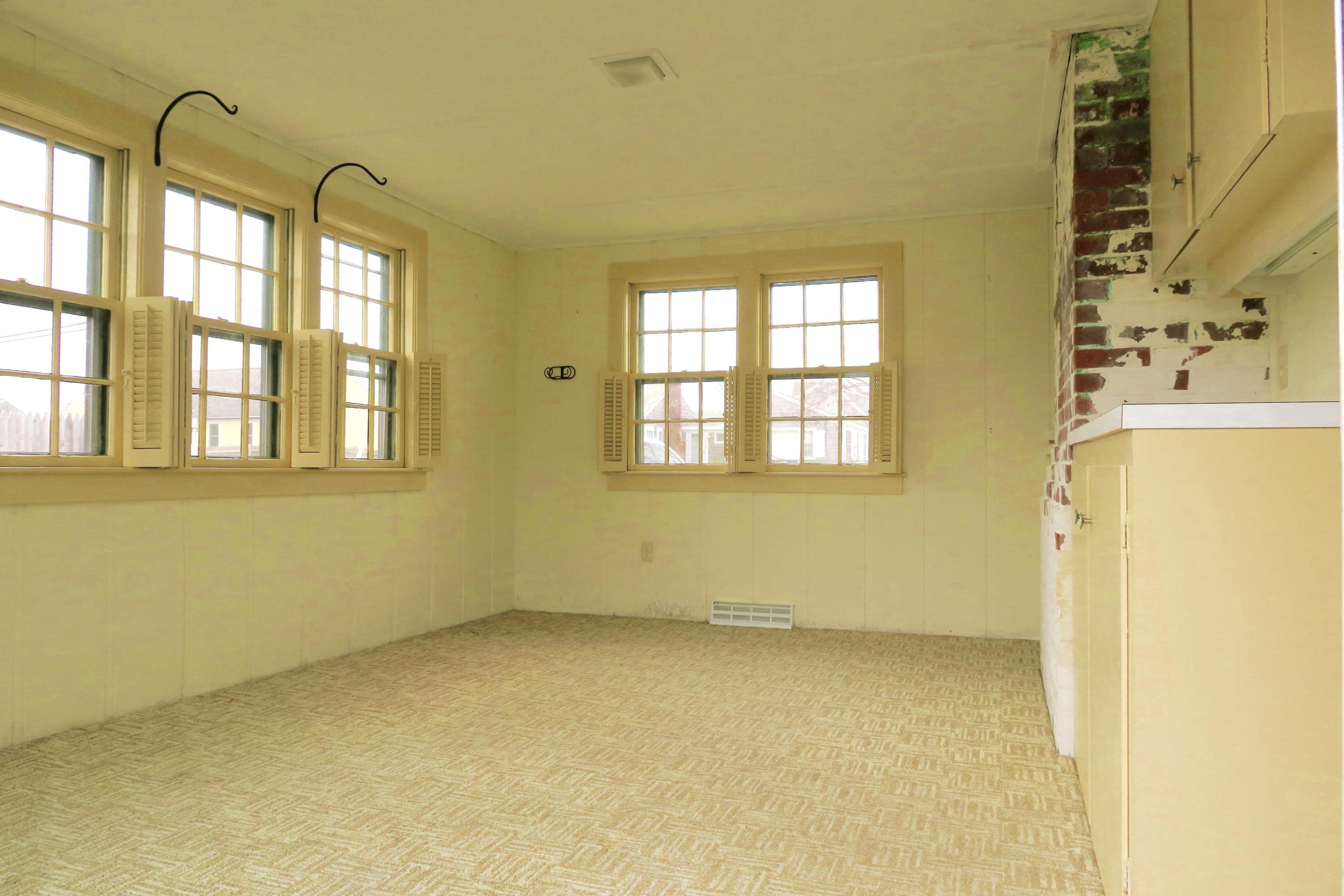 58 Surfside Road West Dennis, MA 02670 - Photo 21 of 31 a view of an empty room with a window