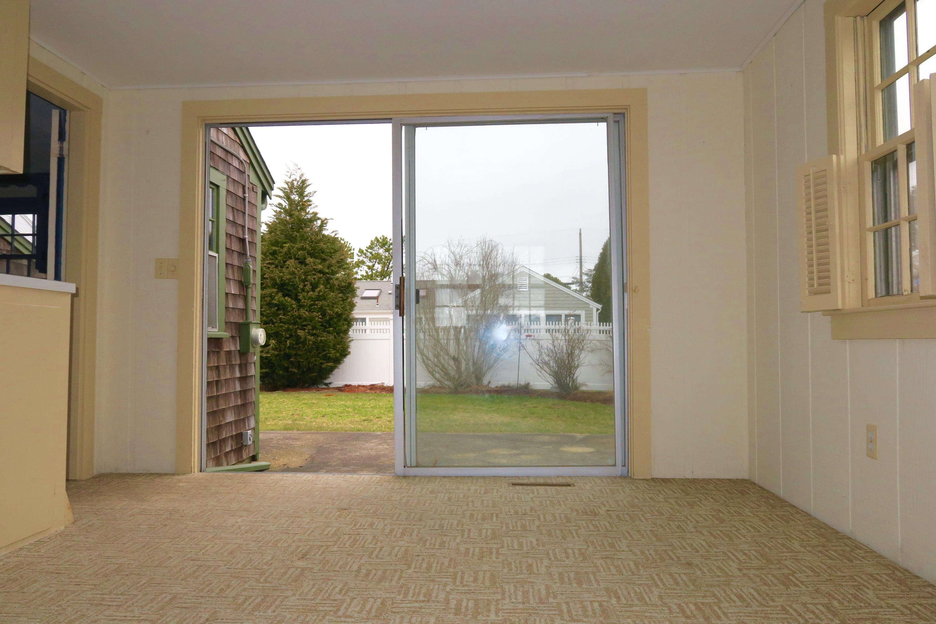 58 Surfside Road West Dennis, MA 02670 - Photo 23 of 31 a view of a room that has a bed