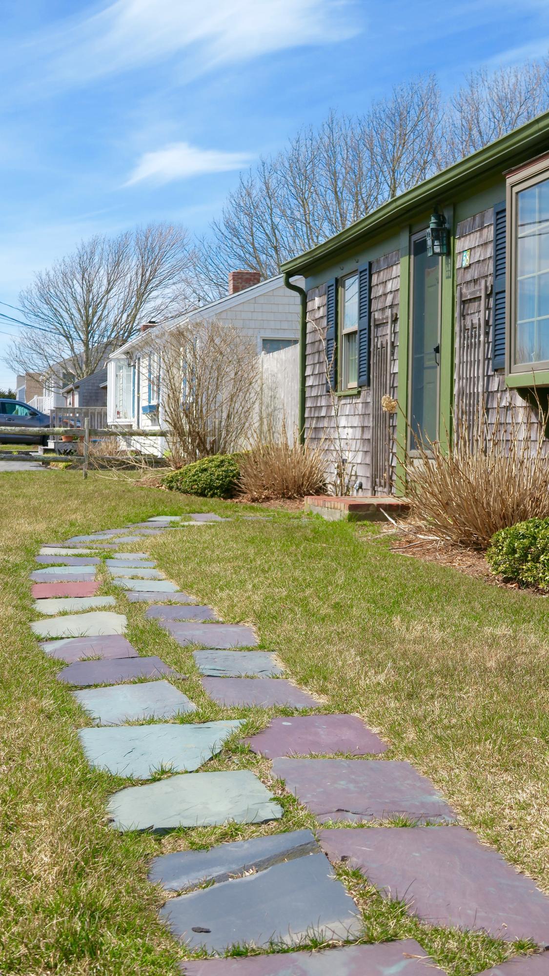 58 Surfside Road West Dennis, MA 02670 - Photo 5 of 31 a front view of a house with a yard