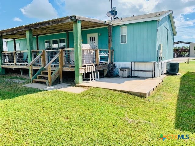 77 Blue Street Port O'Connor, TX 77982 - Photo 1 of 27 a view of a house with swimming pool
