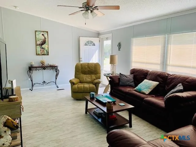 a living room with furniture and a window