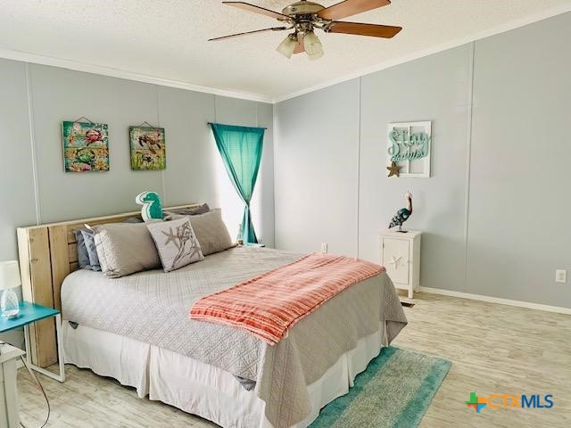 77 Blue Street Port O'Connor, TX 77982 - Photo 16 of 27 a bedroom with a bed and a window