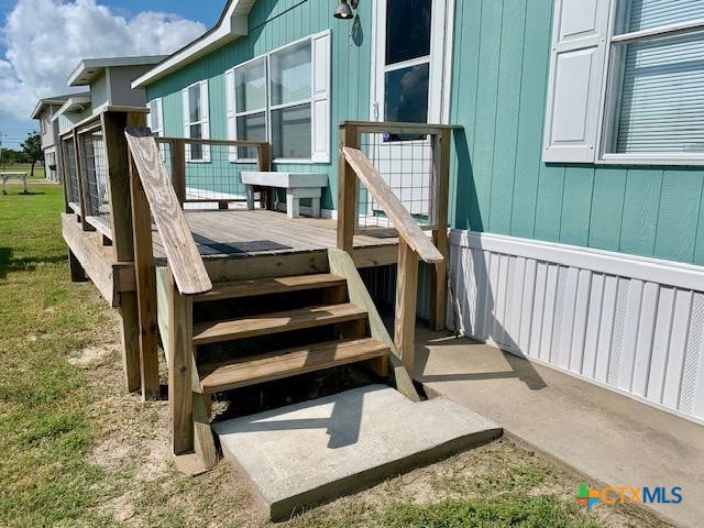 77 Blue Street Port O'Connor, TX 77982 - Photo 2 of 27 a view of entryway with a front door
