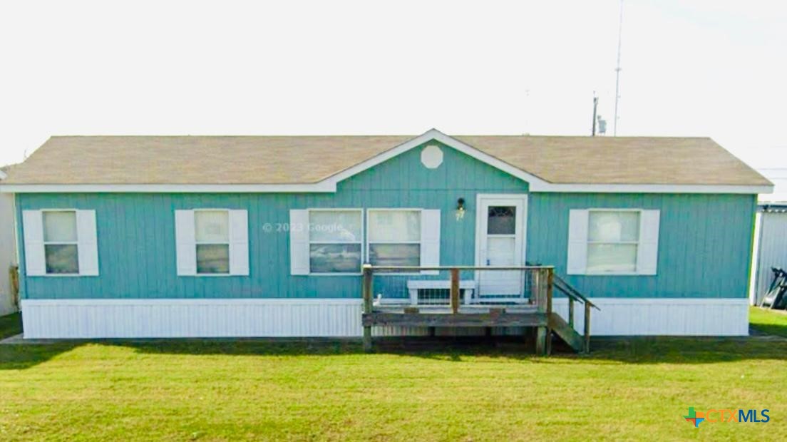 77 Blue Street Port O'Connor, TX 77982 - Photo 26 of 27 a view of a house with a swimming pool