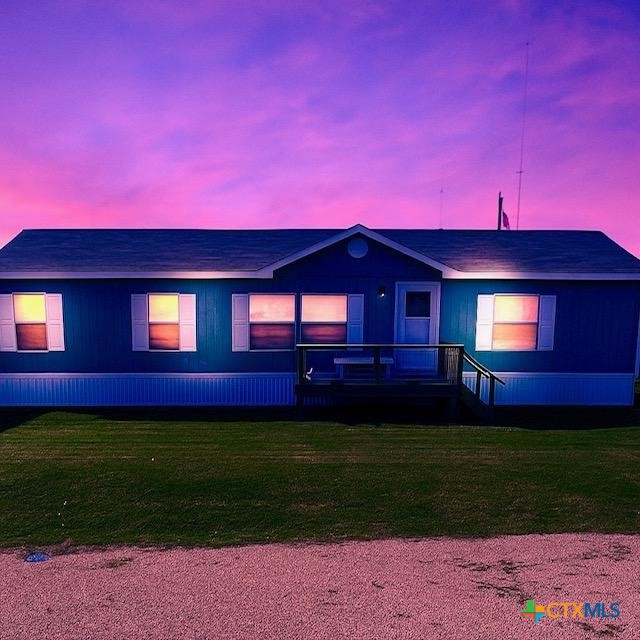 77 Blue Street Port O'Connor, TX 77982 - Photo 27 of 27 a view of a house with a yard