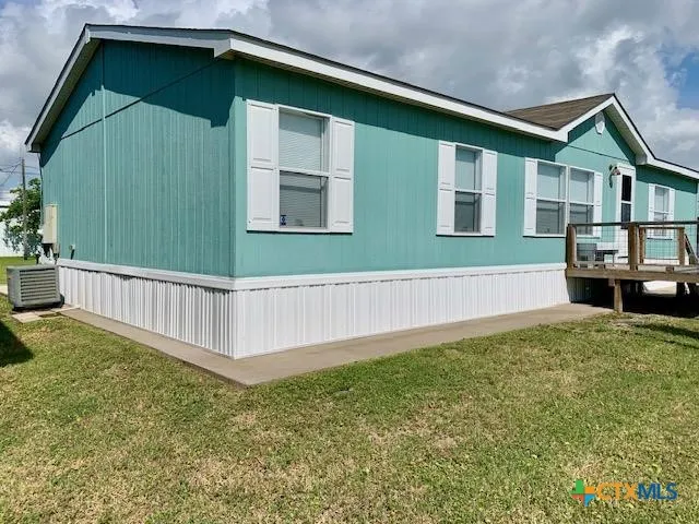 a house with a trees in the background