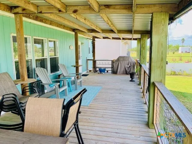 a view of a porch with seating space