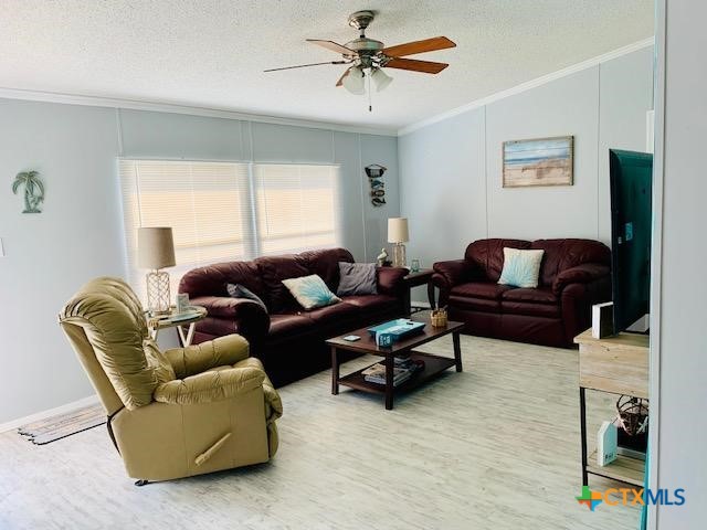 77 Blue Street Port O'Connor, TX 77982 - Photo 9 of 27 a living room with furniture and a window
