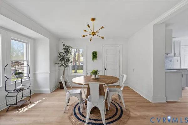 a view of a dining room with furniture and a window