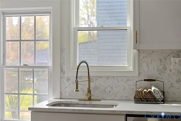 a kitchen with a refrigerator stove and microwave