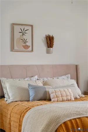 a bedroom with a bed and a dresser