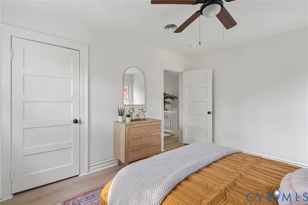a bathroom with a double vanity sink and mirror with window