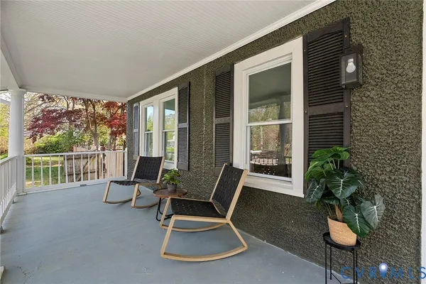 a view of two chairs in balcony