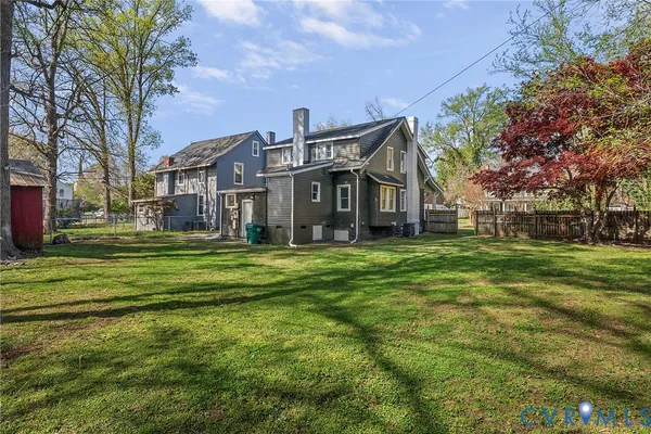 a house view with swimming pool in front of it