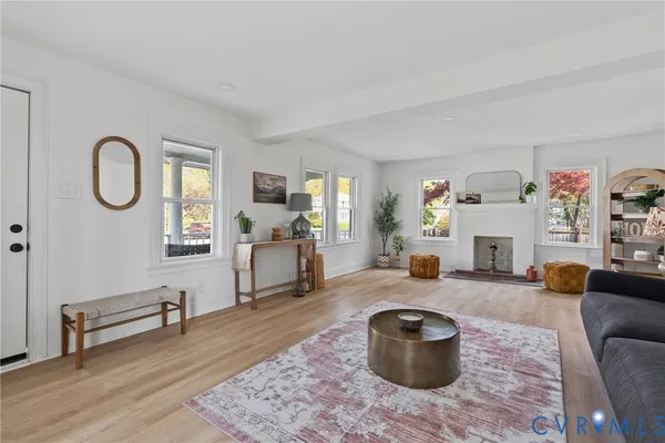 a living room with furniture and a fireplace