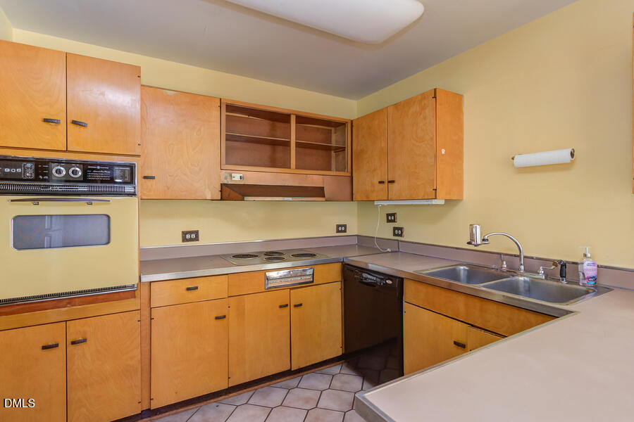 806 Kings Mill Road Chapel Hill, NC 27517 - Photo 12 of 45 a kitchen with stainless steel appliances granite countertop a sink and cabinets