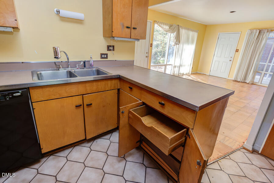 806 Kings Mill Road Chapel Hill, NC 27517 - Photo 13 of 45 a kitchen with stainless steel appliances cabinets a sink and a window
