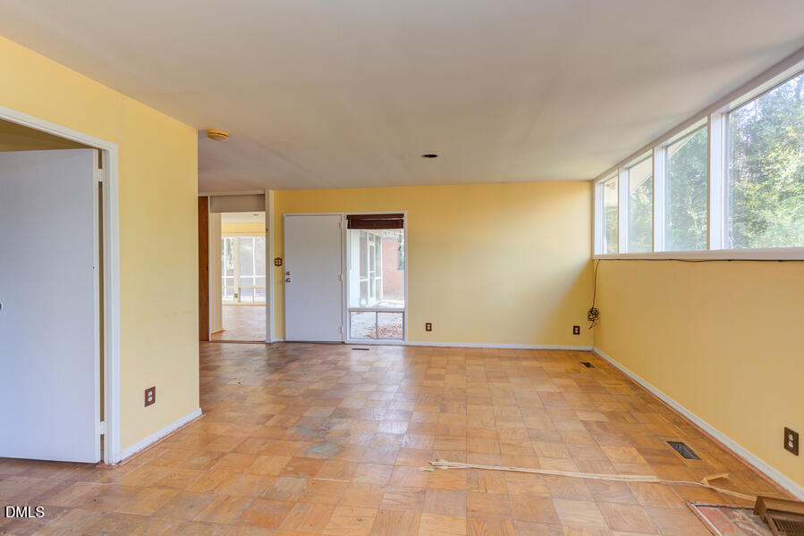 806 Kings Mill Road Chapel Hill, NC 27517 - Photo 19 of 45 a view of an empty room with window and bathroom