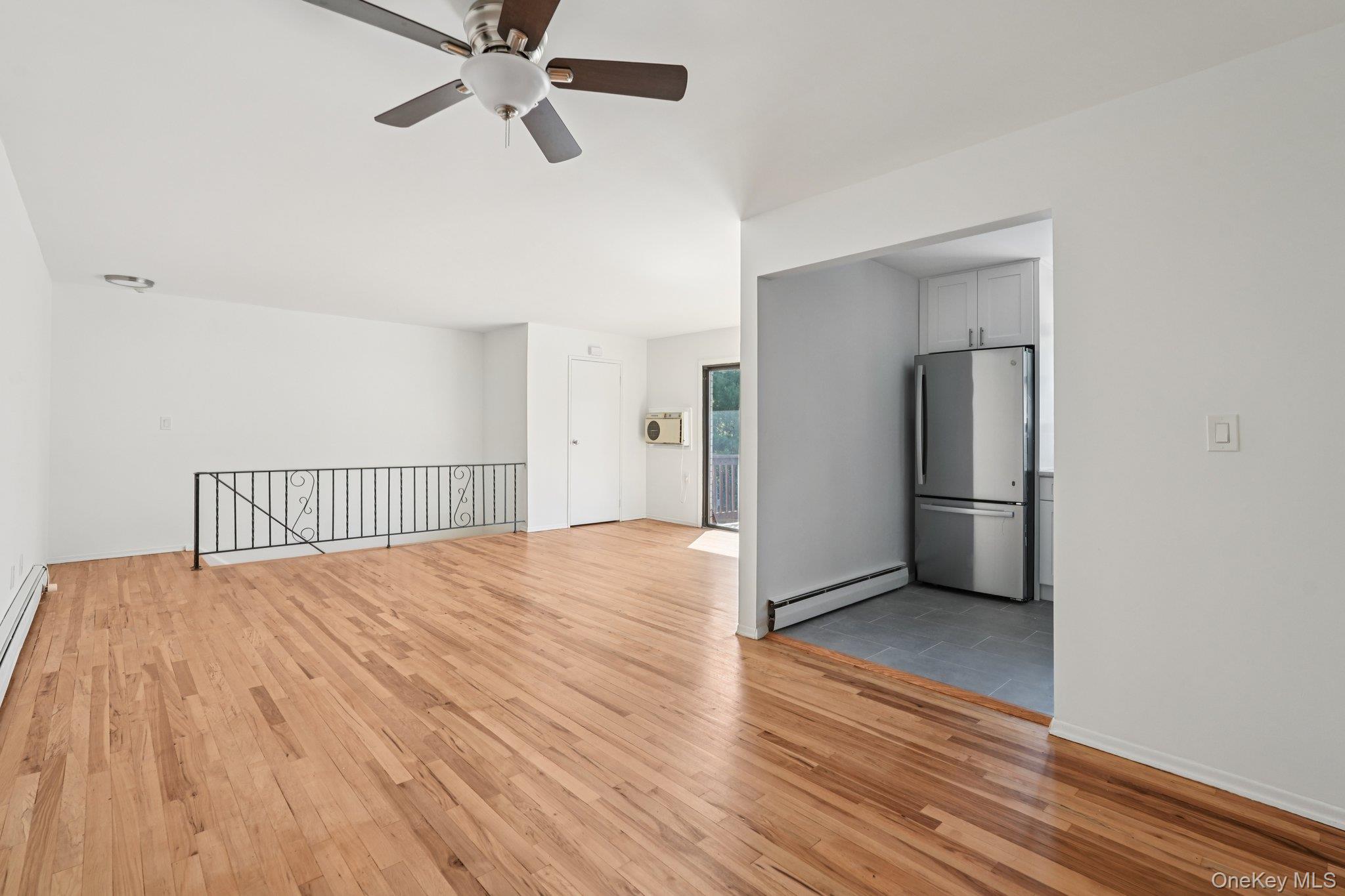 148 Sneden Place West, Unit 148 Spring Valley, NY 10977 - Photo 14 of 37 a view of a room with wooden floor and ceiling fan
