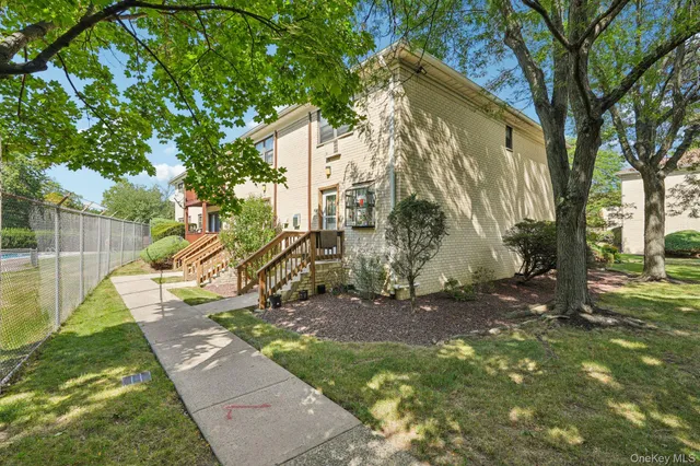 a view of a yard with a tree