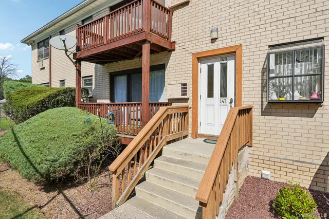 front view of a house with a large window