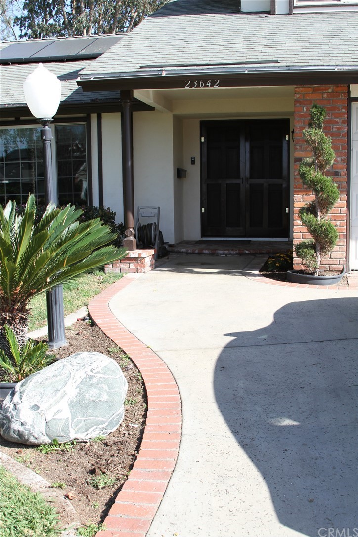 23642 Cavanaugh Road Lake Forest, CA 92630 - Photo 13 of 14 a view of a house with a small yard