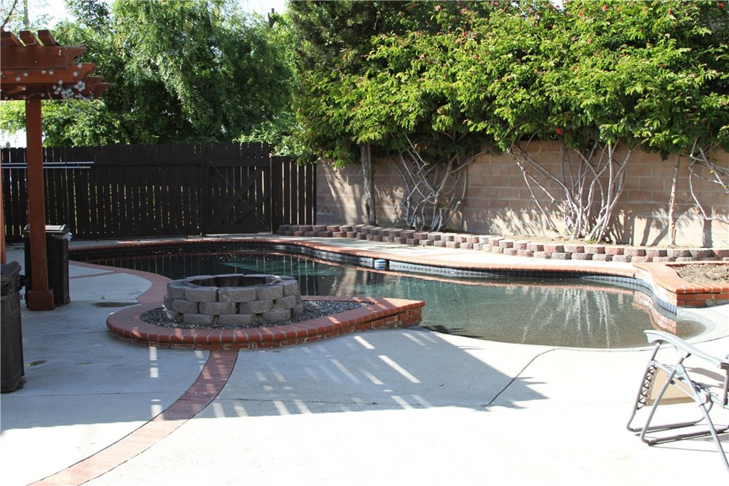 23642 Cavanaugh Road Lake Forest, CA 92630 - Photo 3 of 14 a swimming pool with wooden fence