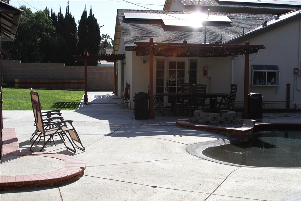 23642 Cavanaugh Road Lake Forest, CA 92630 - Photo 6 of 14 a view of a patio with couches table and chairs with wooden fence