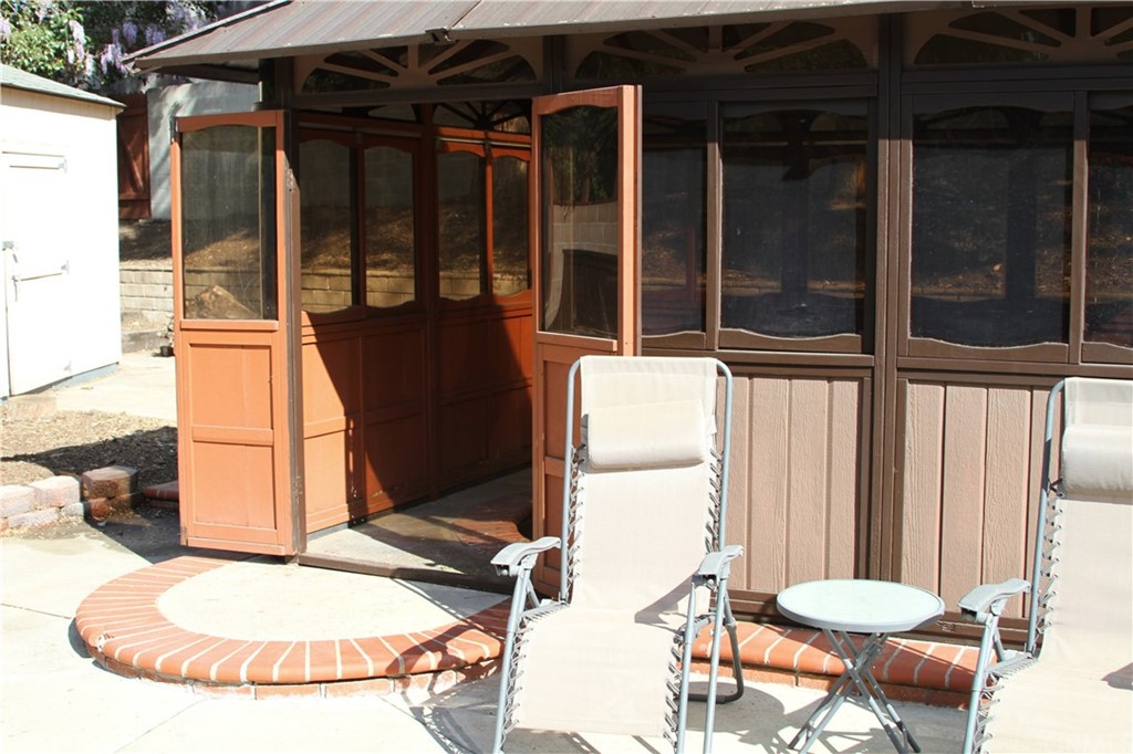 23642 Cavanaugh Road Lake Forest, CA 92630 - Photo 8 of 14 a view of a porch with a table and chairs