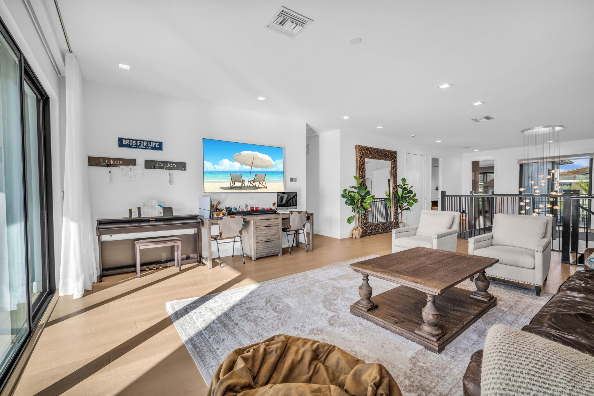 17059 Rainbow Fls Trail Boca Raton, FL 33496 - Photo 27 of 79 a living room with furniture a flat screen tv and kitchen view