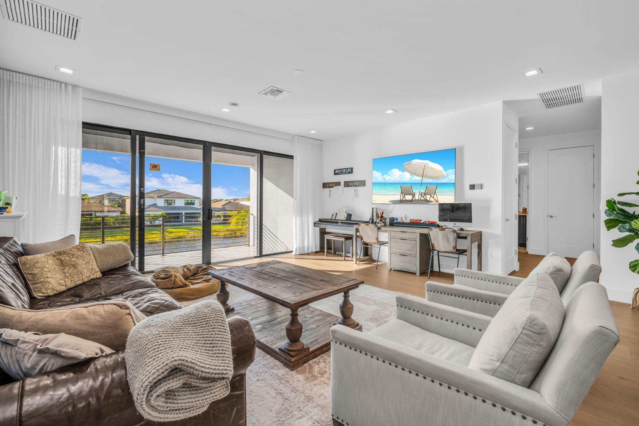 17059 Rainbow Fls Trail Boca Raton, FL 33496 - Photo 28 of 79 a living room with furniture and a large window
