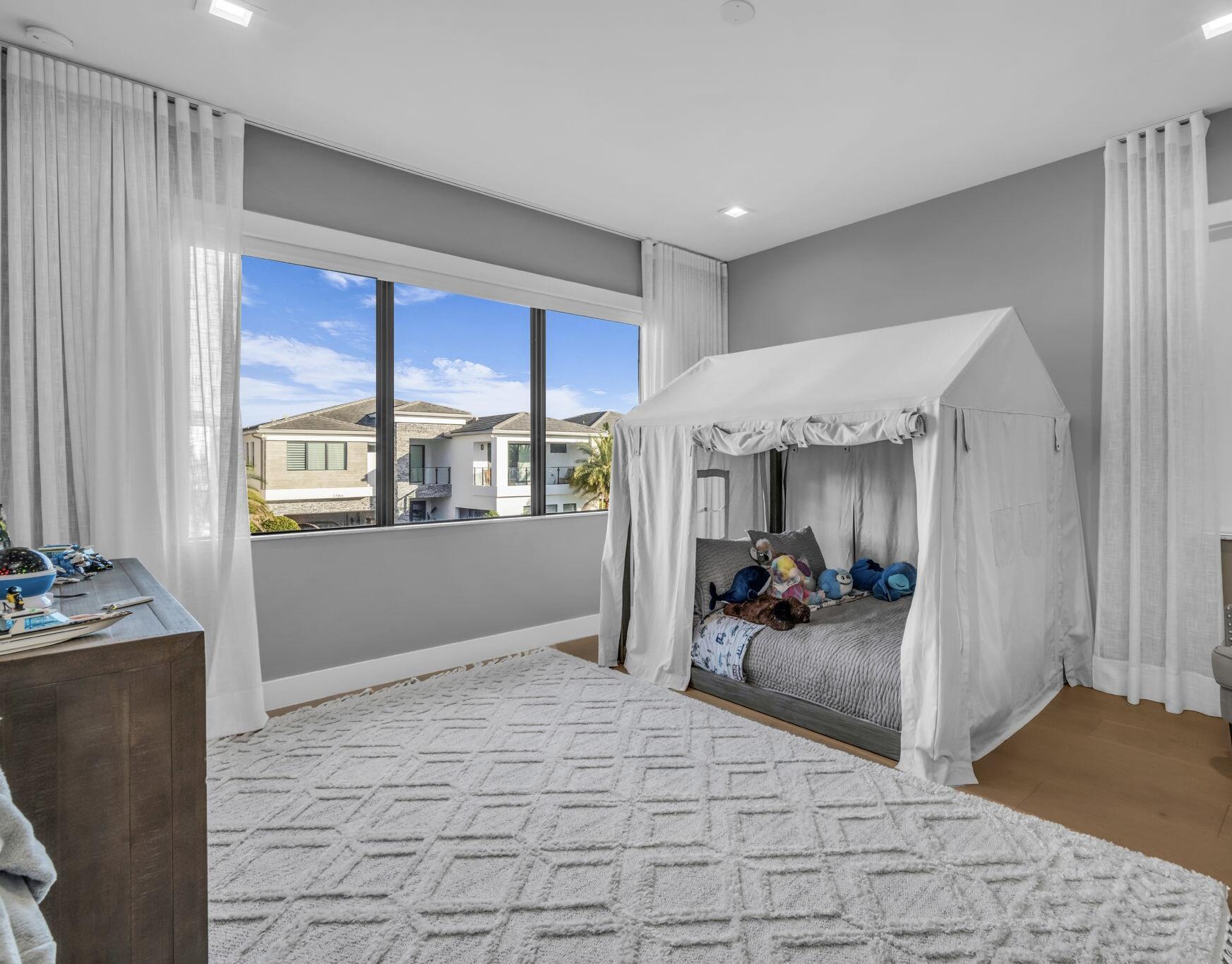 17059 Rainbow Fls Trail Boca Raton, FL 33496 - Photo 36 of 79 a living room with furniture and large windows